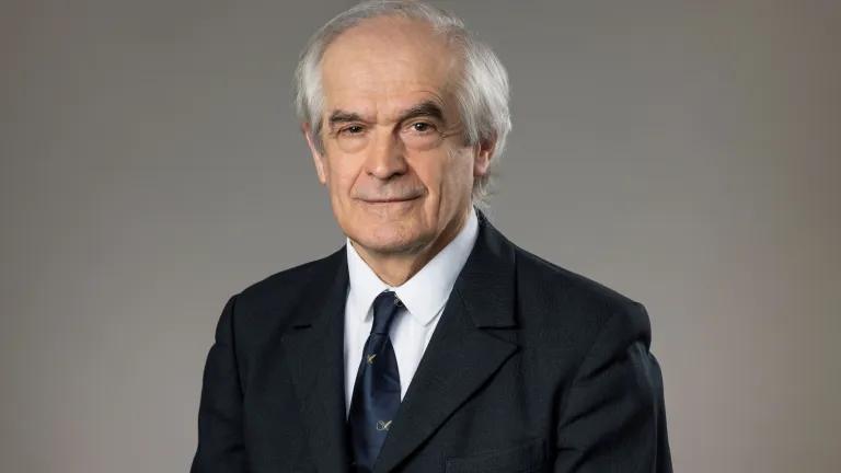 A professional photograph of Professor Gyongy