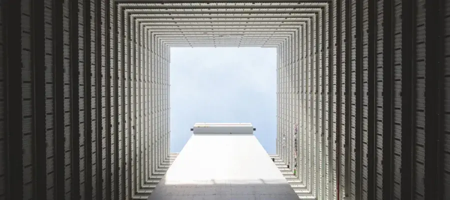 View of internal campus building from the ground looking to the sky