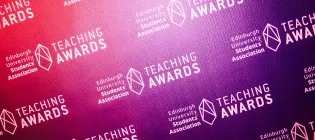 A photo of the teaching awards logo printed across a display board