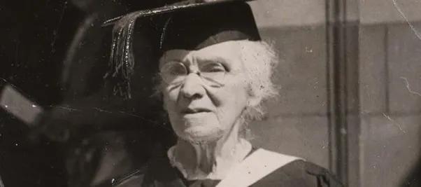 Photo of Flora Philip in 1943 wearing a graduation cap and gown
