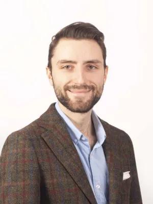 A professional headshot of Antoni Sieminski